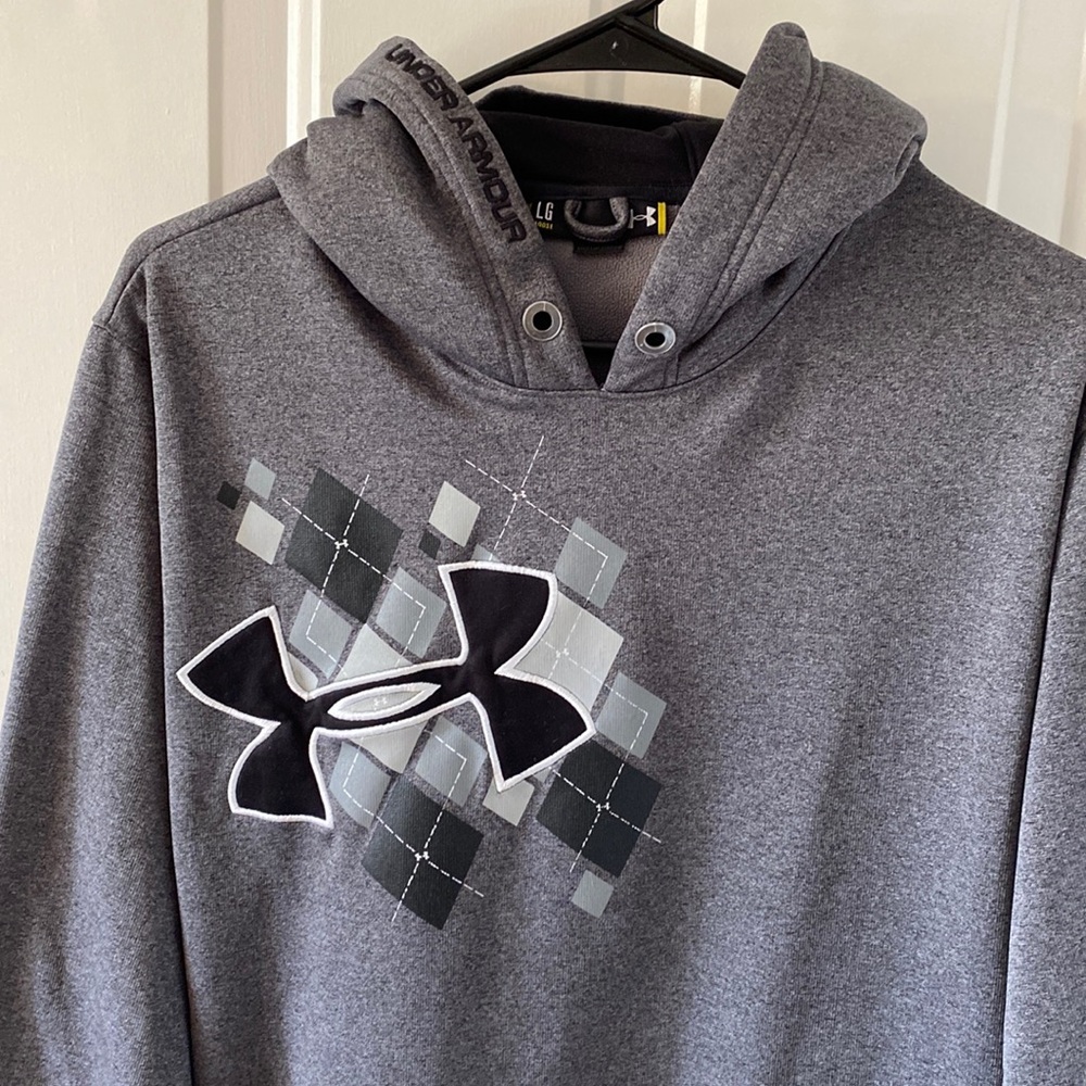 Under Armour polyester gray hoodie, name along hood, front pocket